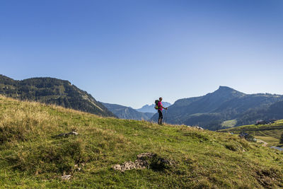 Woman hiking on mountain