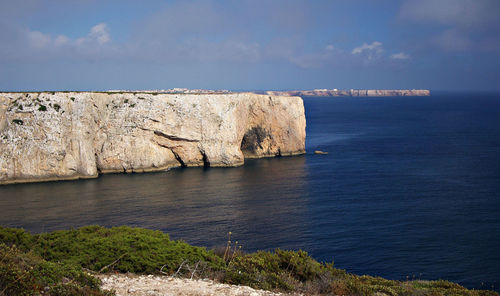 A cliff surrounded by waterscape, algarve, saint vincent's cape