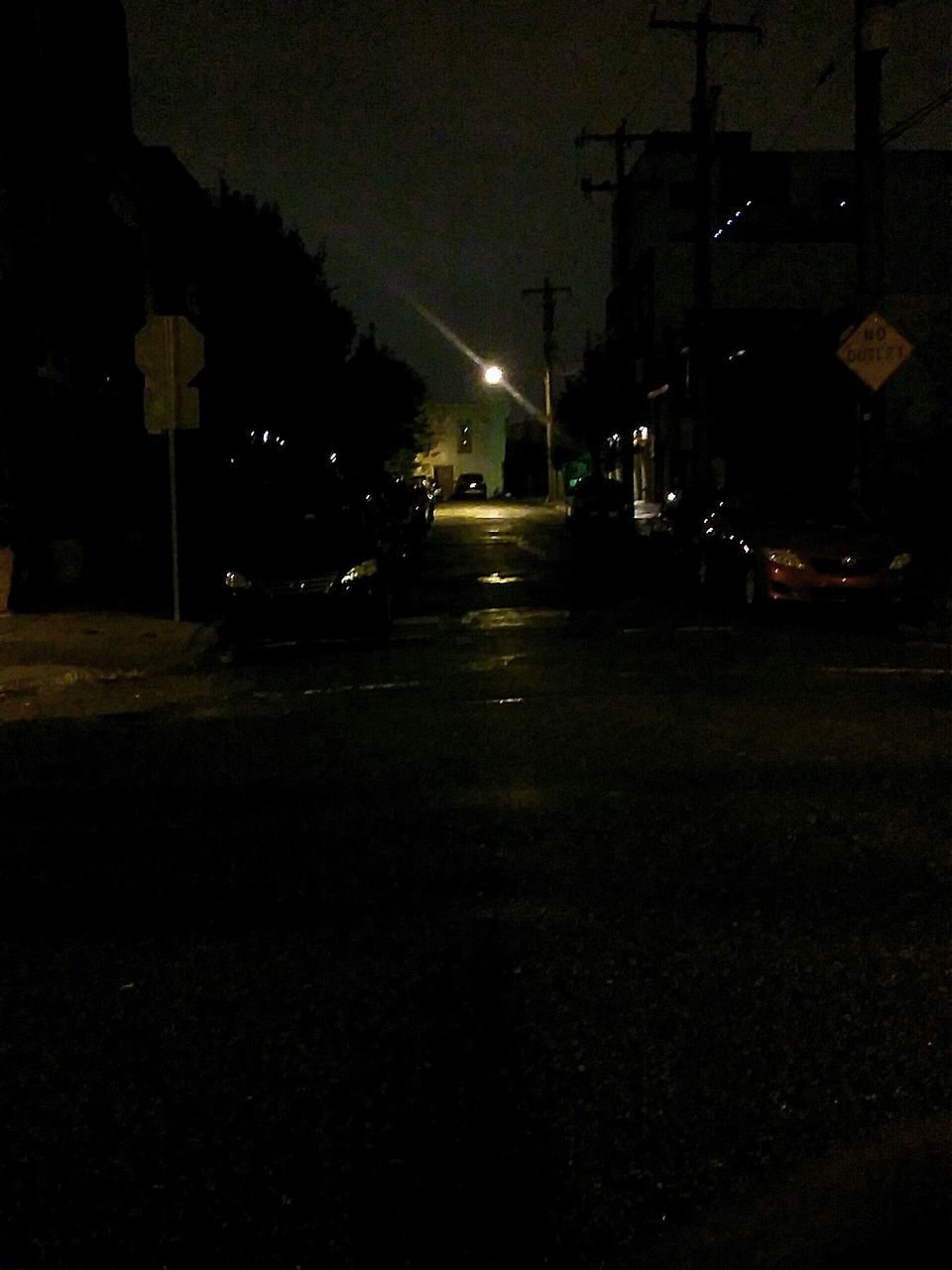 EMPTY ROAD IN CITY AT NIGHT