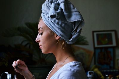 Woman with towel wrapped around her head