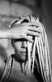 Close-up of young woman with dreadlocks