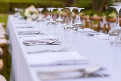 Empty drinking glass on table at restaurant