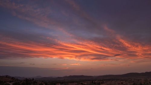 Scenic view of landscape against sky during sunset