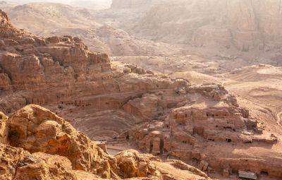 View from the above to the nabataean theatre carved in stone and surrounding tombs, petra, jordan