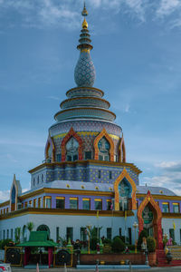 View of temple building against cloudy sky