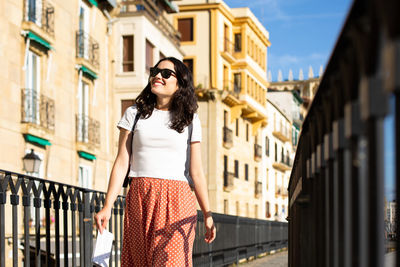 Woman wearing sunglasses standing outdoors