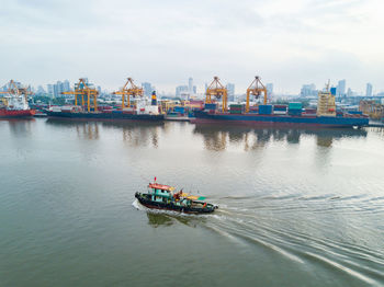 Nautical vessel on river against sky