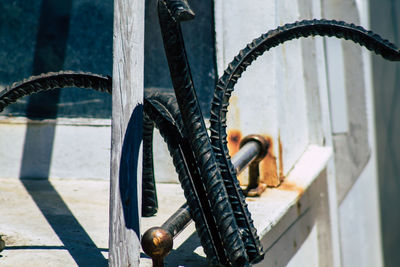 Close-up of rusty bicycle wheel against wall