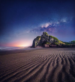 Scenic view of desert against sky at night