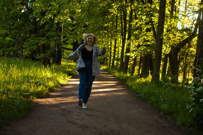 Full length of woman walking on field