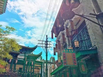 Low angle view of buildings in city against sky