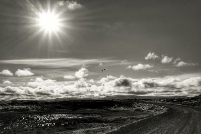 Scenic view of landscape against cloudy sky