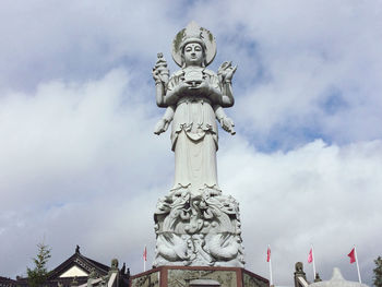 Low angle view of statue against sky