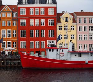 Residential buildings by river in city