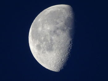 Low angle view of moon against clear sky at night