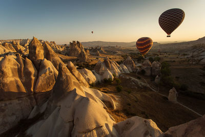 Aerial view of hot air balloon over city