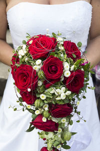 High angle view of red rose in vase