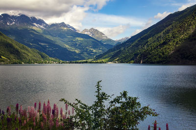 Scenic view of calm lake against mountain range