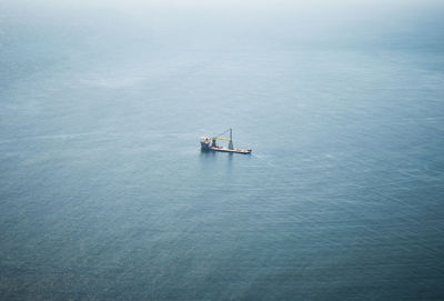 High angle view of ship sailing on sea