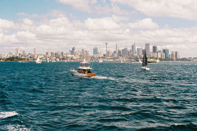 Scenic view of sea and buildings against sky