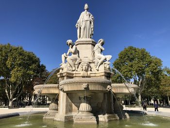 Statue of fountain against sky