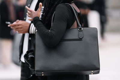 Young woman holding mobile phone