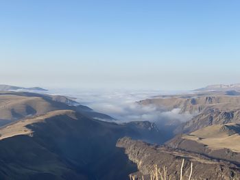 Aerial view of dramatic landscape against sky