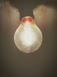 Low angle view of illuminated light bulb