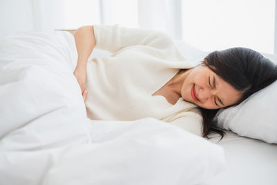 Woman sleeping on bed