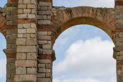 Low angle view of old ruins against sky