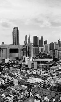 High angle view of modern buildings in city against sky