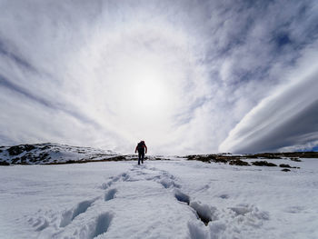 Spain, sierra de gredos, man hiking in snow