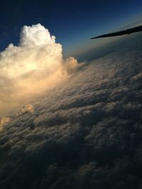 Aerial view of airplane wing against sky