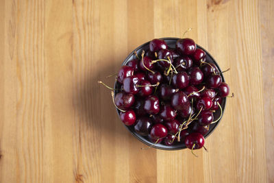 High angle view of cherries in bowl on table