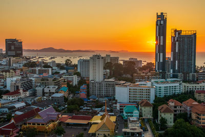 Cityscape against sky during sunset