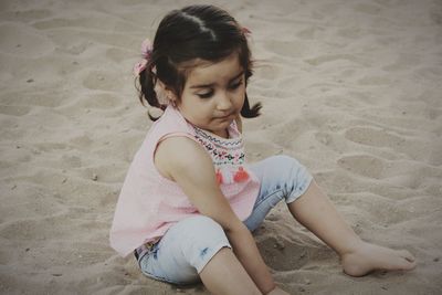 Girl sitting on beach