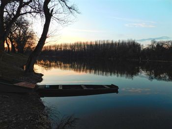 Scenic view of lake at sunset