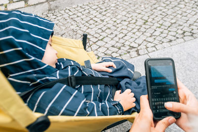 High angle view of man using mobile phone