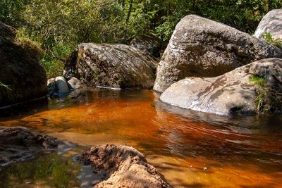 Scenic view of rock formation in lake