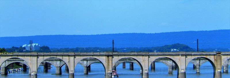 View of bridge against clear blue sky