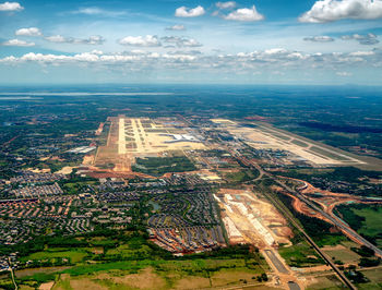 High angle view of city buildings against sky