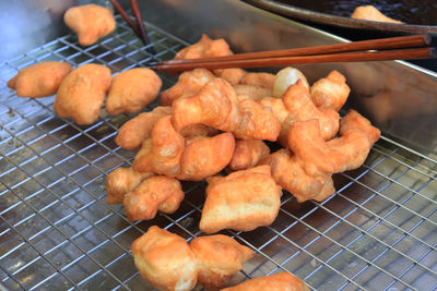 High angle view of meat on barbecue grill