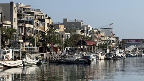 Boats moored at harbor