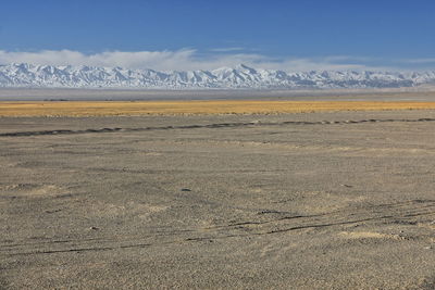 Scenic view of snowcapped mountains against sky