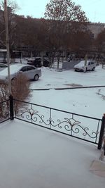 Snow covered street in city