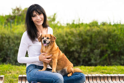 Portrait of a woman with dog - pet lover - adoption concept