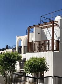 Low angle view of building against clear blue sky