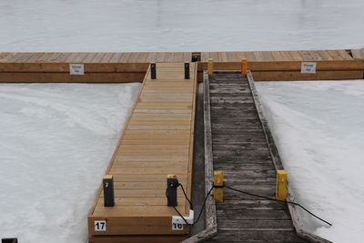 High angle view of pier over river during winter