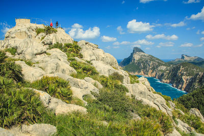 Scenic view of rocks and mountains against sky