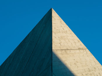 Low angle view of historical building against blue sky